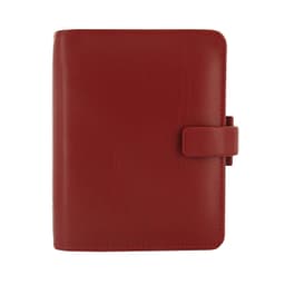 A red organiser with a clasp closure and a smooth finish, featuring branding on its surface.