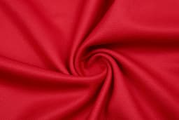 A close-up of red fabric displaying a smooth, swirling texture. The material appears soft and lightweight.