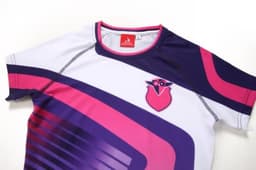 A purple, pink, and white short-sleeved bating costume featuring a logo on the chest.
