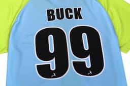 A blue and green full button baseball tee featuring the name "BUCK" and the number "99" on the back.