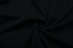 A black cotton T-shirt fabric twisted in a spiral pattern. The material appears smooth and flexible.