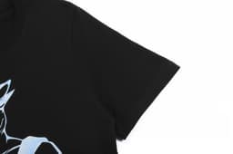 A black cotton t-shirt featuring a unique design on the front and a logo on the sleeve.