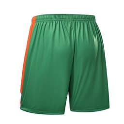 Green junior soccer shorts with orange accents, featuring an elastic waistband and a logo.