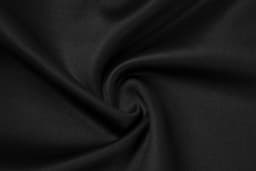 A close-up of black fabric, displaying a smooth, swirling texture with a subtle sheen.