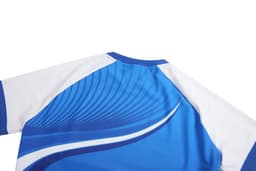 A blue and white tight-fitting t-shirt with dynamic wavy patterns and a logo on the back.