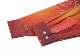 A vibrant hi-vis work shirt in shades of orange and red with a unique pattern, featuring a buttoned cuff and logo.