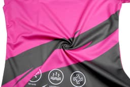 A vibrant pink and black cheerleader uniform fabric featuring logos and a swirling design.