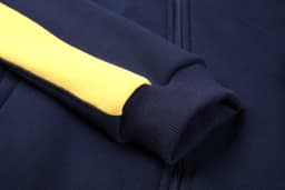 A navy hoodie featuring a yellow stripe along the sleeve, with a ribbed cuff and a zip closure.