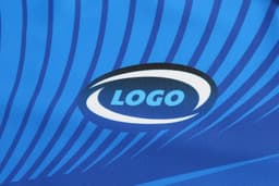 A blue fabric with dynamic stripes featuring a logo in the centre.