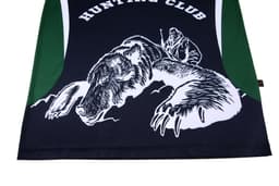 A black and green polo shirt featuring a graphic of a bear and a hunter. It has a logo on one side.