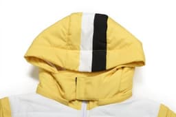 A yellow coat with a hood featuring black and white stripes, designed for winter wear.