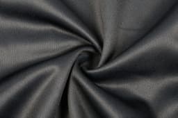 A close-up of black fabric, showcasing a smooth texture with a spiral pattern, suitable for a varsity jacket design.