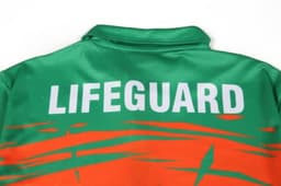 A vibrant green and orange suit with a collar, featuring the word "LIFEGUARD" prominently displayed.