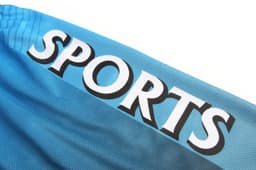 A blue sports uniform featuring the word "SPORTS" prominently displayed, with a logo present.