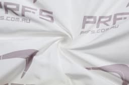 A swirl of white fabric featuring a subtle logo pattern. The texture appears soft and smooth.