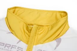 A close-up of a coat featuring a yellow collar and hood, part of a removable sleeves design.