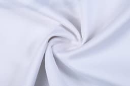 A white sports singlet made from smooth fabric, featuring a logo and designed for athletic wear.