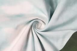 A light blue fabric with a soft, smooth texture, featuring a swirling pattern. The material is suitable for beach apparel.