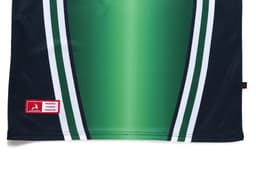 A polo shirt in green gradient with navy blue and white stripes, featuring a logo and branding label.
