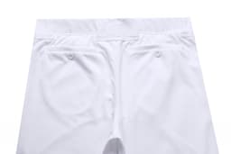 A pair of white baseball/cricket pants featuring two pockets at the front. The garment has a button closure.