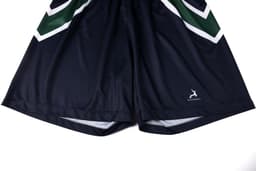 A pair of navy shorts with green and white graphic detailing, featuring a logo on the lower hem.
