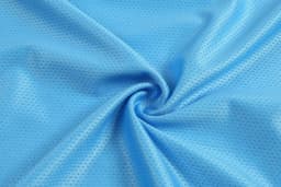 A light blue textured fabric in a swirling pattern, featuring a breathable mesh design.