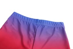 A women's running suit featuring a gradient design with blue at the top and red at the bottom. It includes a logo.