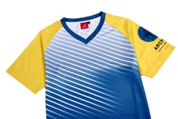 A blue and yellow archery team shirt features a striped design and a logo on the sleeve.