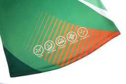 AFL vest featuring a vibrant green and orange design with various graphic symbols and a logo.