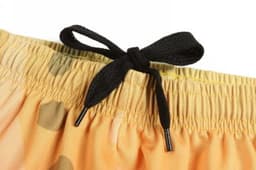 A pair of swim shorts featuring a black drawstring on a warm, orange patterned fabric.