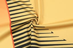 A textured fabric in yellow with black striped patterns, featuring an orange accent. Includes a logo design.
