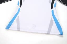 A sports uniform featuring a predominantly white design with blue and black accents, and a logo at the bottom.