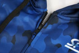 A blue camouflage hoodie featuring a zippered front closure and a logo on the side.
