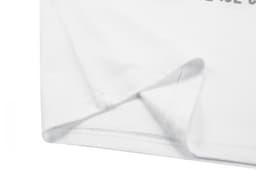 A white cotton t-shirt featuring a folded hem and sleeve, with a logo on the fabric.