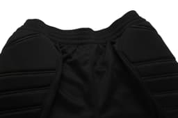 Black goalkeeper pants featuring padded protection and a comfortable elastic waistband. Includes stitching detail.