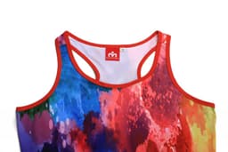 A colourful fitness singlet with a red trim featuring a vibrant splash of blues, reds, and yellows. Includes a logo.