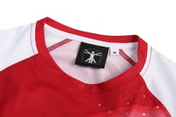 A red and white sports uniform top with a crew neck and a logo on the label.