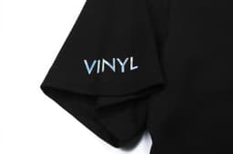 A black cotton t-shirt featuring a sleeve logo in light blue text.