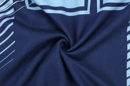 A navy blue hoodie featuring light blue geometric patterns and a branding logo.