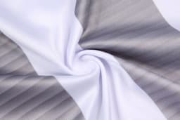 A patterned fabric featuring horizontal grey and white stripes, showcasing a smooth texture.