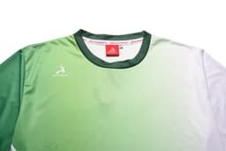 A green and white gradient multi-sport T-shirt with a logo and a red neckline.