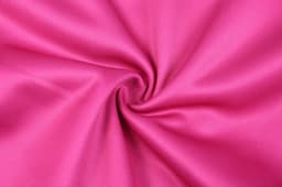 A smooth, vibrant pink fabric, showcasing its texture and sheen in a swirling pattern.