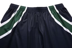 Universal shorts in navy blue with green and white stripes on the sides. Features an elastic waistband.
