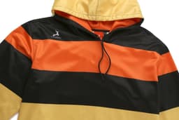 A kangaroo hoodie featuring bold black, orange, and yellow stripes with a logo on the chest.