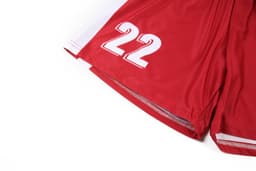 Red women's soccer uniform shorts featuring white accents and number '22' printed on the side.