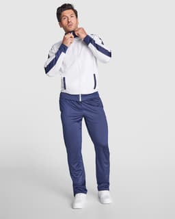 A tracksuit featuring a white jacket with navy stripes and matching navy pants. The jacket has a zip and a logo.