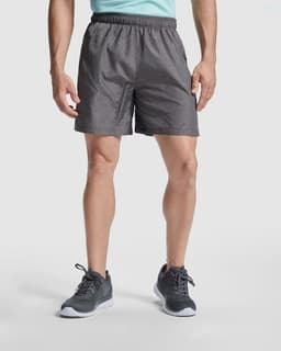 Celtic shorts in dark grey, featuring an elastic waistband and a logo on the side. Ideal for sports and outdoor activities.