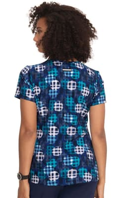 A patterned top featuring blue, white, and teal designs. The back view shows short sleeves and a round neckline.