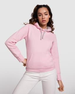 A pink hooded sweatshirt featuring a front pocket and a contrasting hood. It has a logo on the chest.