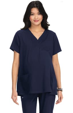 A maternity top in navy blue, featuring a V-neck design and a front pocket, worn by a model.